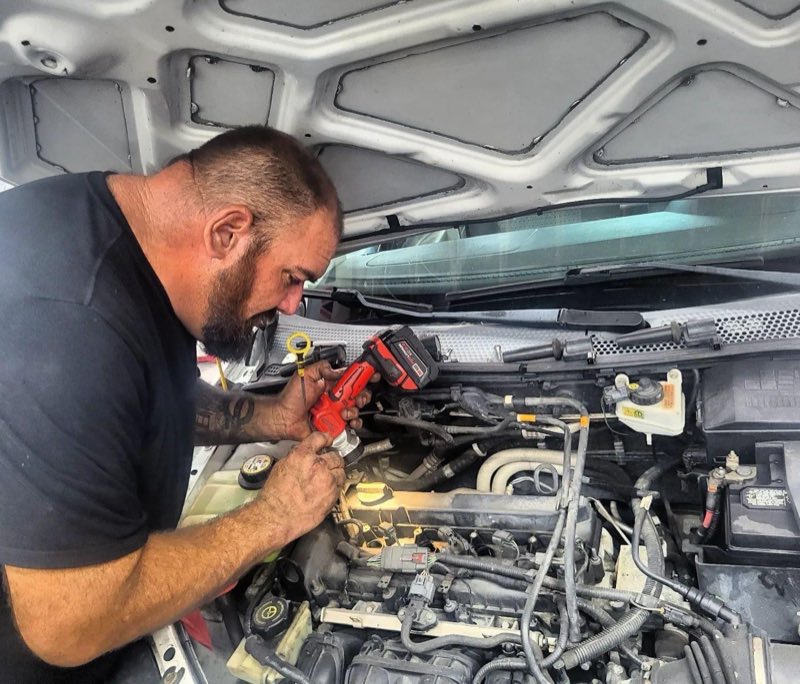Mechanic at work under the hood